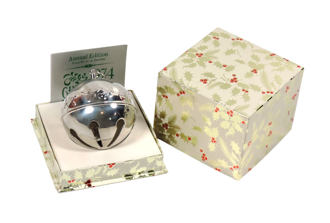 Christmas Bell, 1974 Christmas Bell by Wallingford, Connecticut, Annual Edi: Christmas Bell, 1974 Christmas Bell by Wallingford, Connecticut, Annual Edition, Forth in a Series, embossed toy motif, in orig white w/silver/red foiled box, Exc unused cond, 3"H x 4"W x 4"D.