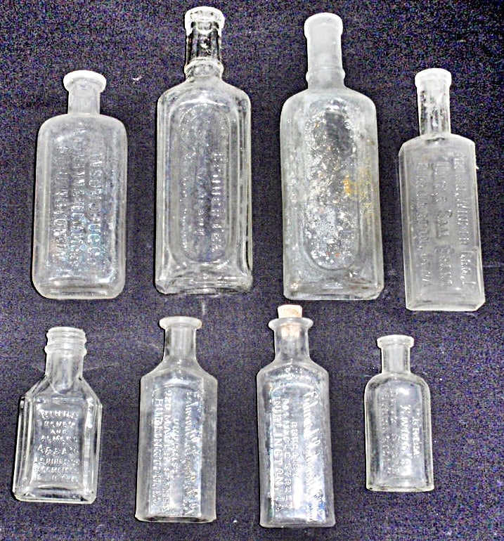 8 Burlington, IA Embossed Glass Drug Bottles, by various retailers incl Ran (1 of 1)
