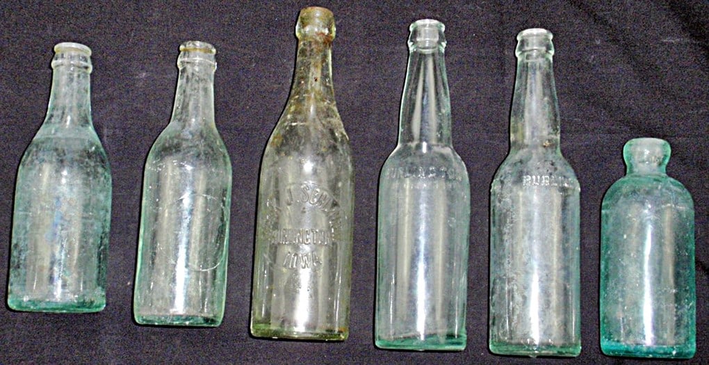 6 Burlington, IA Embossed Glass Bottles, incl "Frank J. Schlager" & "Moehn": 6 Burlington, IA Embossed Glass Bottles, incl "Frank J. Schlager" & "Moehn" and 2 unlabeled 1 with no markings, in various cond. :largest 9.5"H.