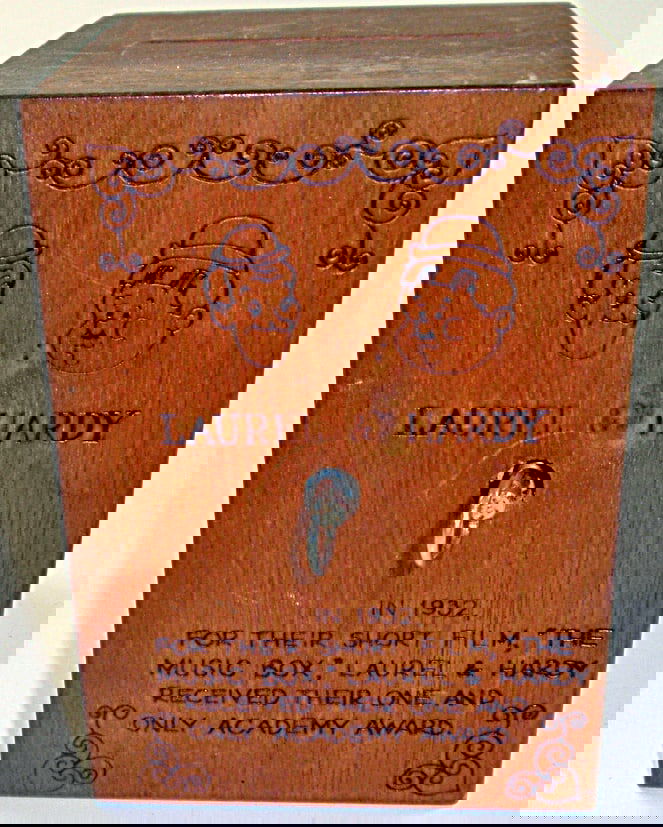 A Laurel & Hardy Pyrography wood music box/bank, Exc working cond 1978 by T: A Laurel & Hardy Pyrography wood music box/bank, Exc working cond 1978 by Toystagia, 5.5"H.