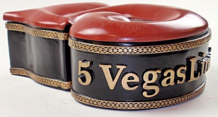 A Vegas Limitada 2010 Cigar Humidor: Heavy cast resin in the shape of a numeral 5, Exc cond.11"L.