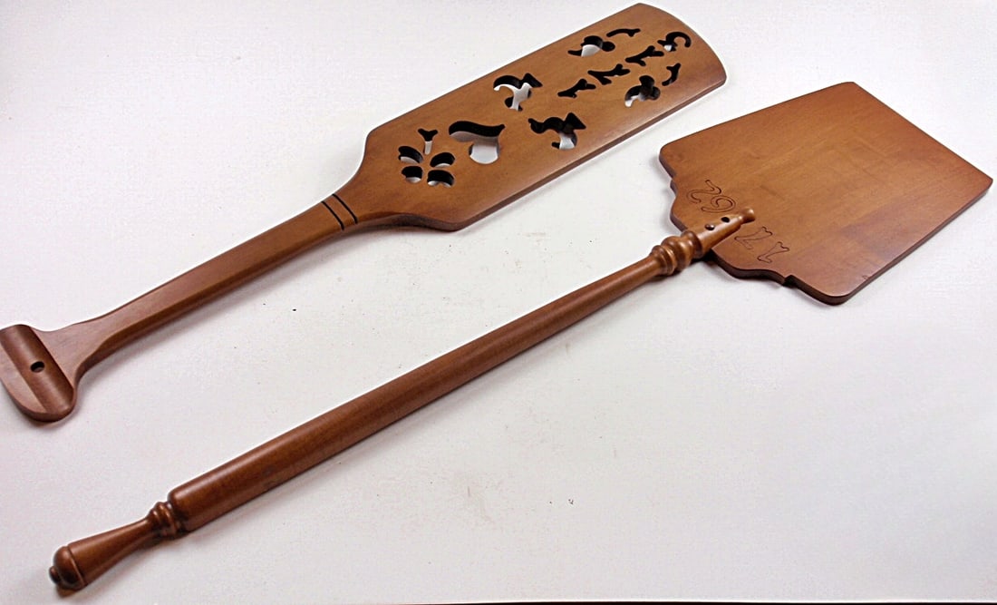 A Pair Of Early American Style Baker's Peels: Carved wood, one w/scroll cut designs, the other marked Tell City, Exc cond. Largest 36"L.