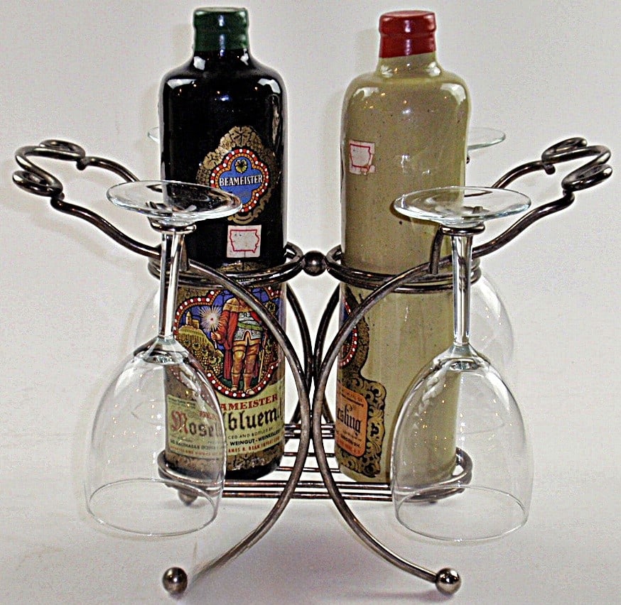 A German Wine Set: Two sealed unopened stoneware bottles of Beameister circa 1970s, in a metal stand with 4 glasses, Exc cond. 13.5"H.