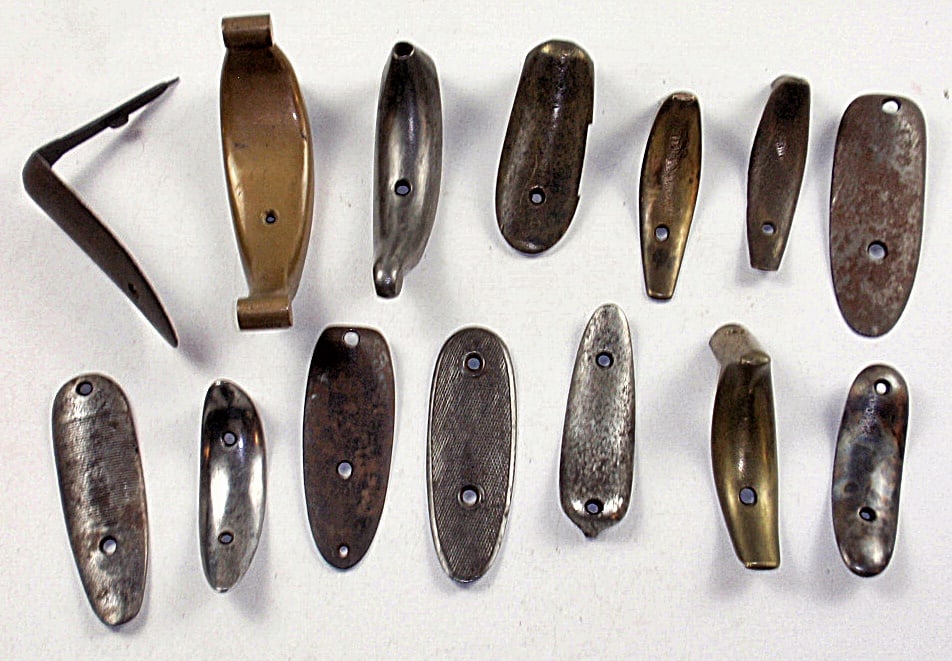 Lot of vintage metal gun butt plates (approx. Dozen): Variety of different plates. All in good cond. Largest approx. 7".