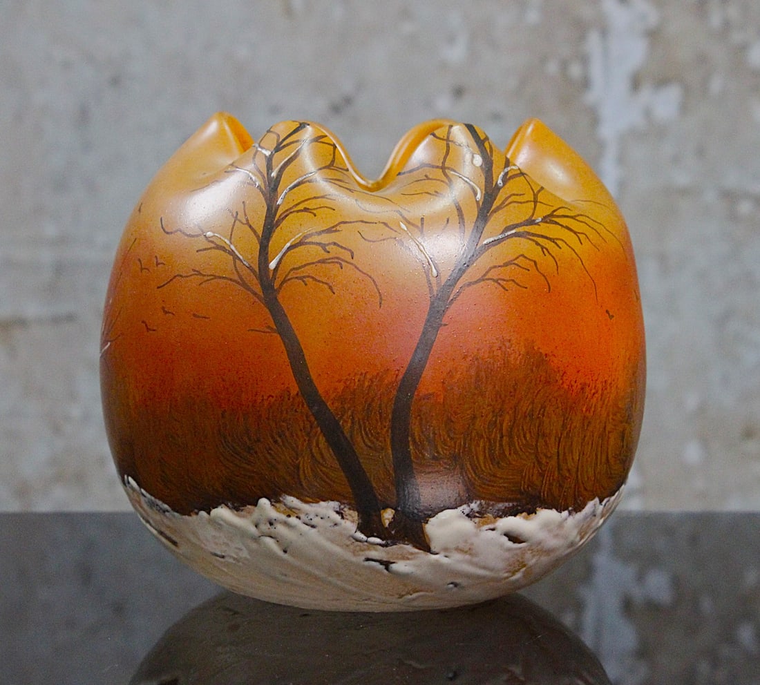 A Legras Winter Scene French Art Glass Vase: Enameled with thick frosty white on an amber ground w/barren trees in charcoal, signed in enamel "Legras" Exc cond, 5"H.