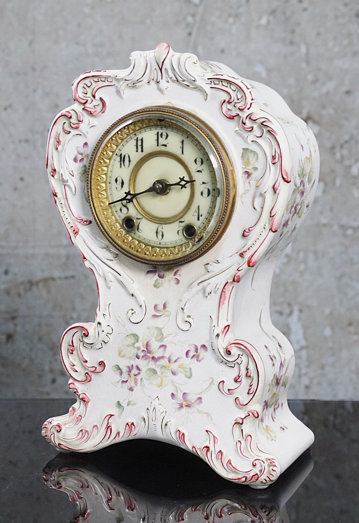 A Victorian Royal Bonn Style Porcelain Mantle Clock: Rococo scrolled case with hand painted florals, unmarked, Exc. working cond. 10.5"H.