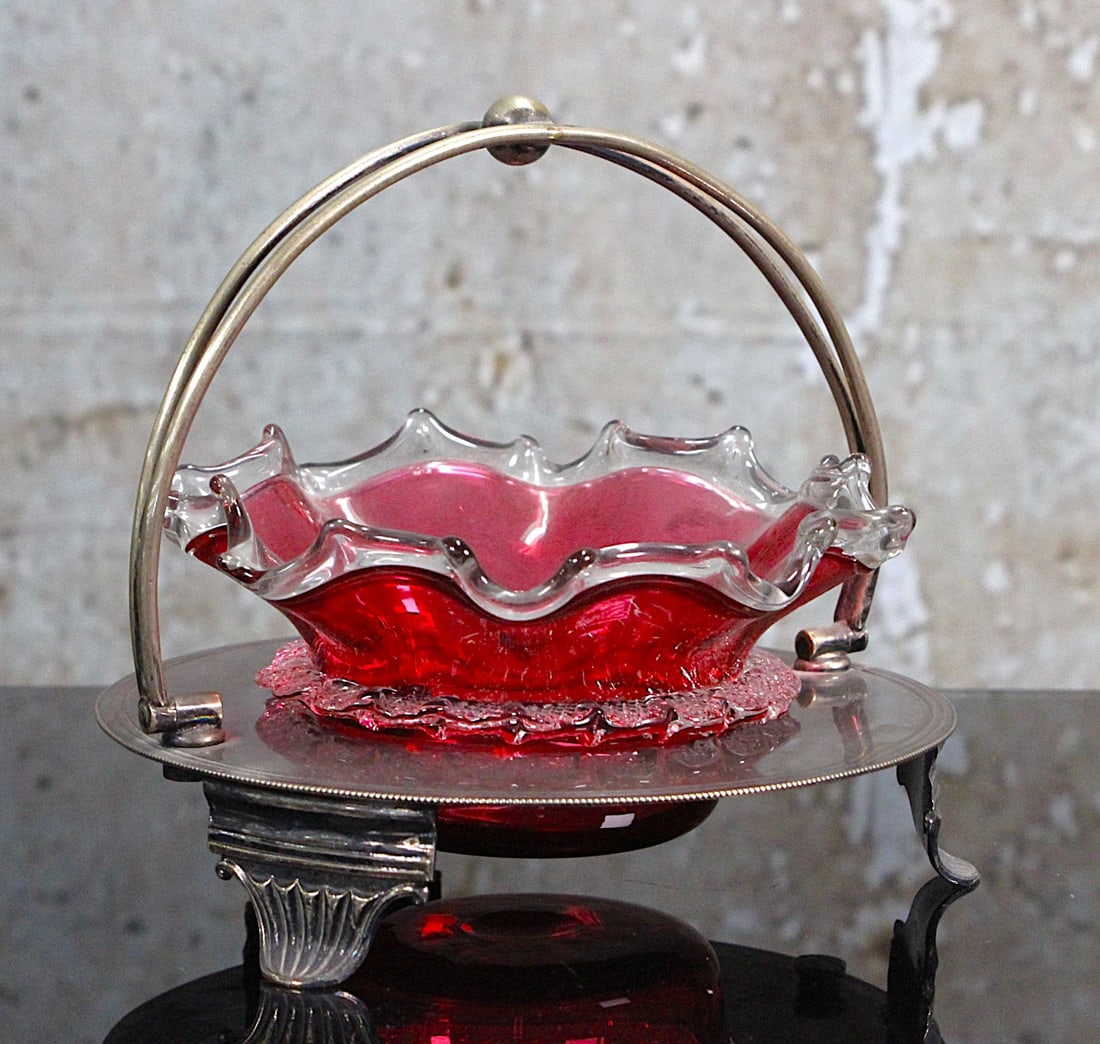 A Victorian Cranberry Art Glass Sweetmeat: With ruffled rim and rigoree in a Sheffield plate stand, ground pontil, Exc. cond. 6"W.