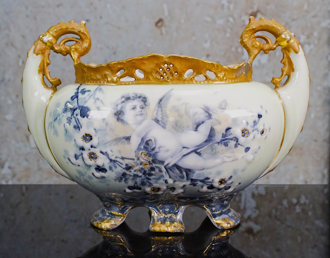 An Austrian Artist Decorated Fernery: 19th century with pierced collar and handles finely painted with a cherub and raised enamel blossoms, FW Vienna mark, VG cond. with hairline to verso 9"W.