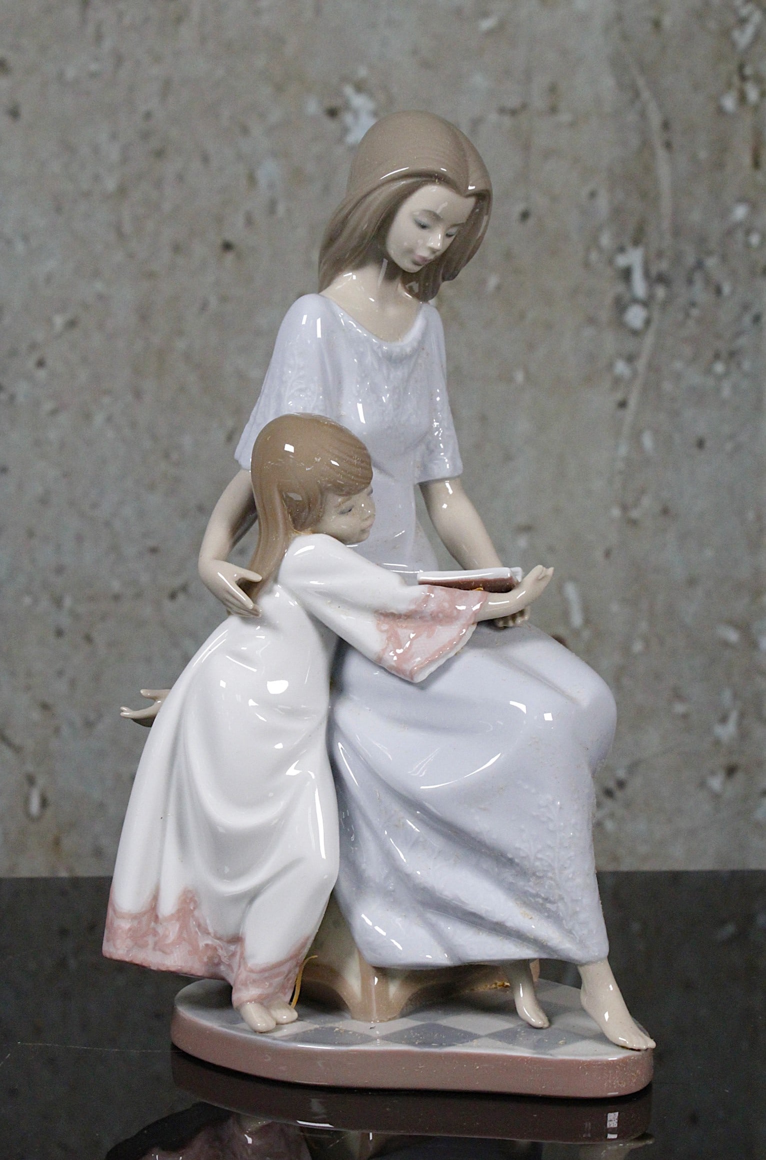 A Lladro Porcelain Figure "Bedtime Story": #5457, retired signed and dated by the artist May, 11th 1993, Exc. cond, includes orig. box not illustrated Exc. cond. 10.75"H.