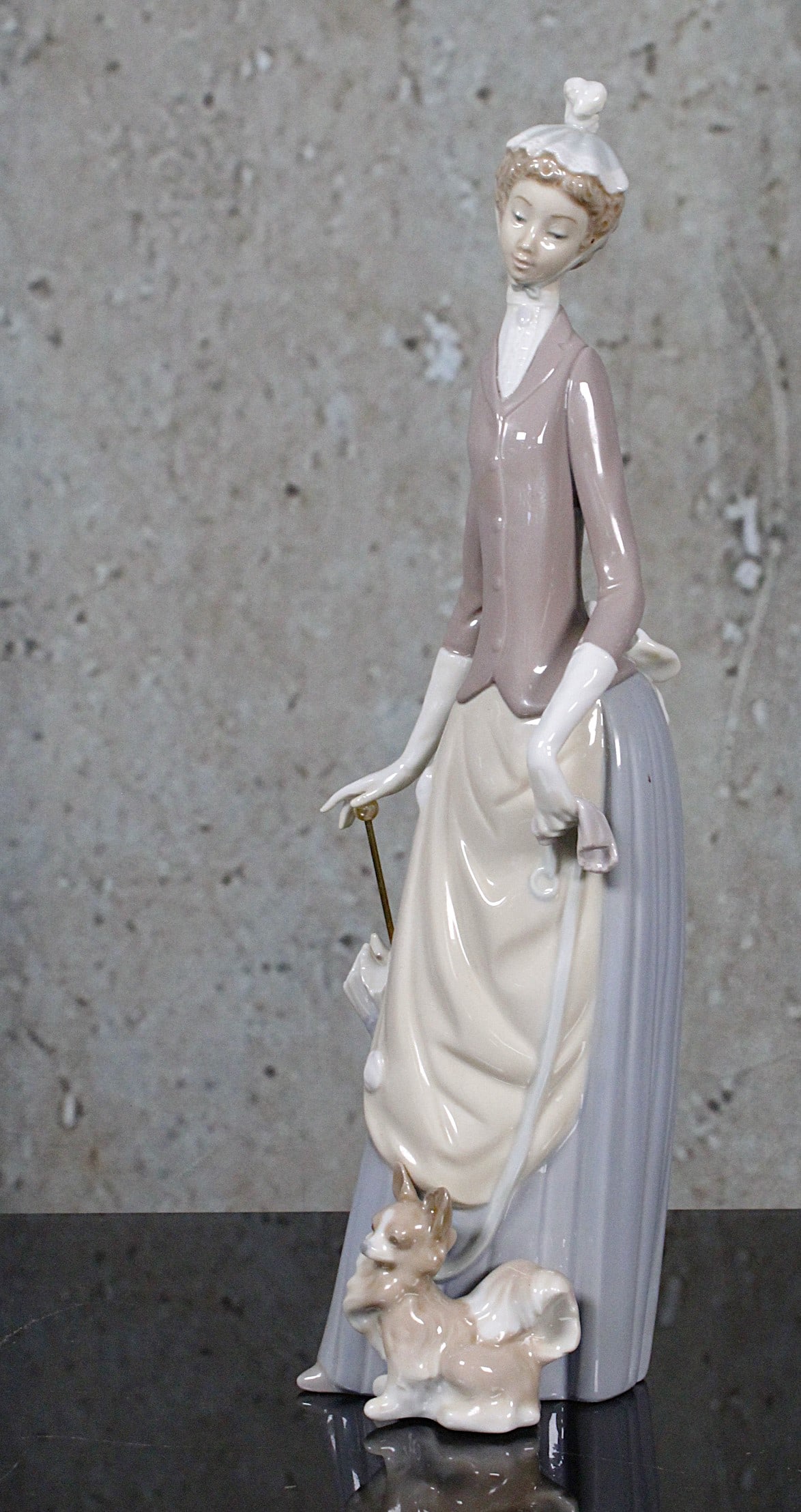 A Lladro Porcelain Figure "Woman With Dog & Umbrella": #4761, 1973-1982, retired, Exc. cond, includes original box not illustrated,13.75"H