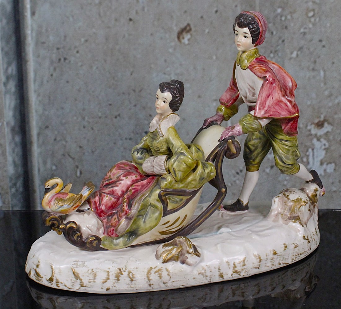 A Large Capodimonte Figural Group: Italy 20th century of a winter scene in hand painted ceramic, Exc cond. 14"L.