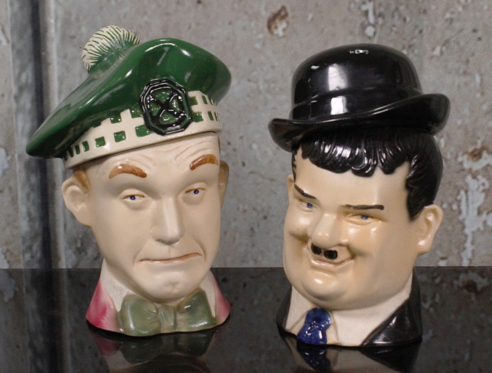 Laurel & Hardy Ezra Brooks Decanters: Hand painted porcelain by Heritage China 1976, VG cond noting a repaired hat/cover to the first. 9"H