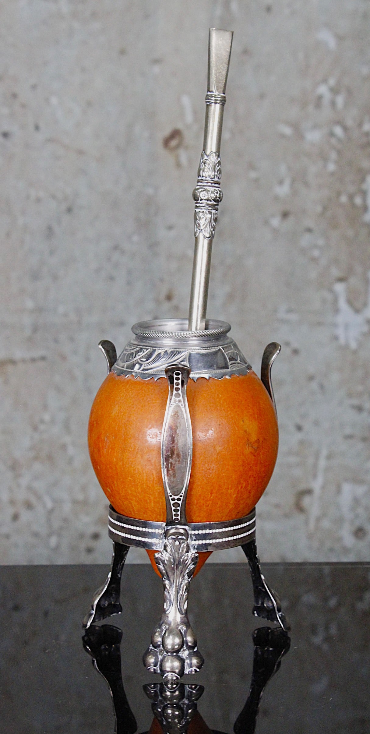 An Alpaca Mate Tea Gourd & Tea Straw: South America early to mid 20th century, polished gourd with silvered stand and silvered straw stamped "Alpaca Eberle" Exc cond. 5.5"H & 8.25"L.