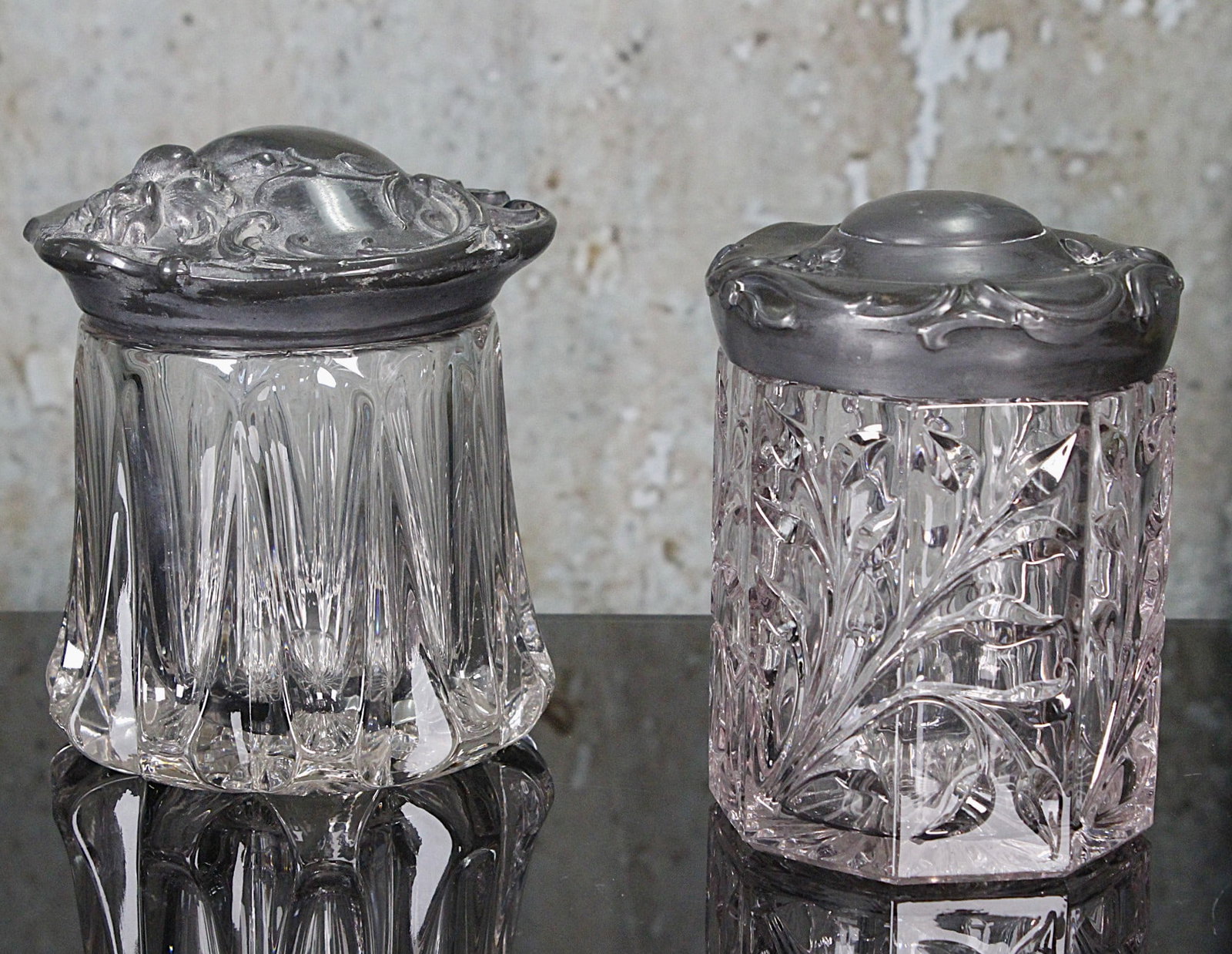 A Pair Of Victorian Tobacco Humidors: Circa 1900 in crystal w/quadruple plate covers, Exc cond. 6"H.