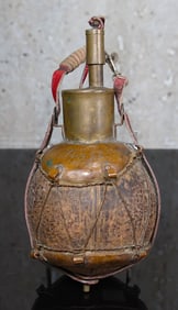 A Copper Mounted Coconut Powder Flask