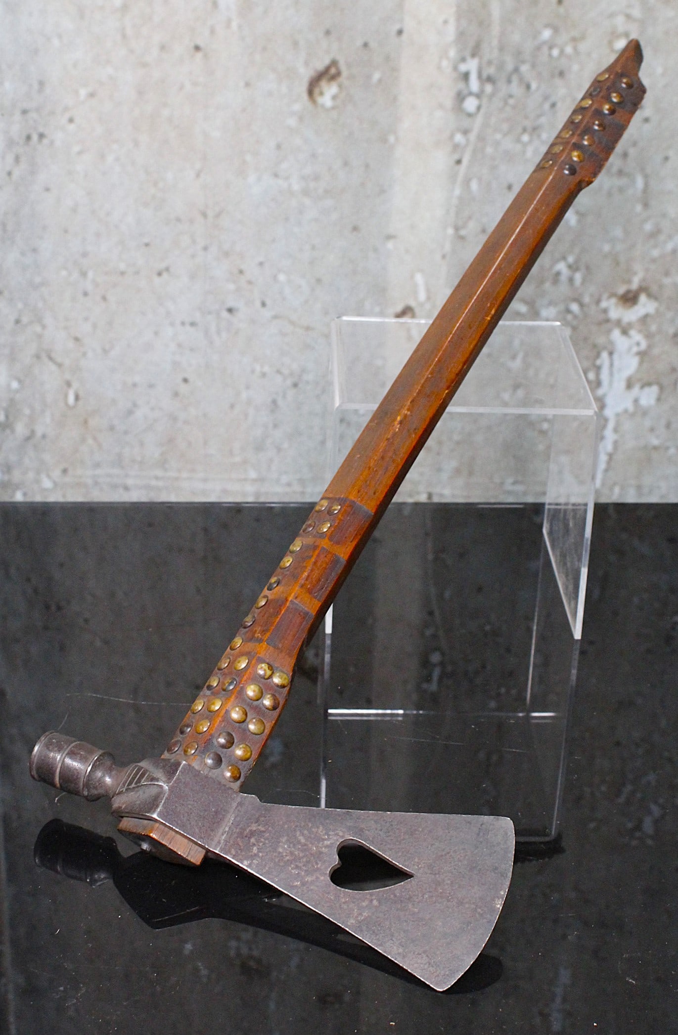 A Native American Trade Style Pipe Tomahawk: Cast Iron with heart cutout on carved handle with brass tack decoration, likely 20th century, VG+ cond. 21"L
