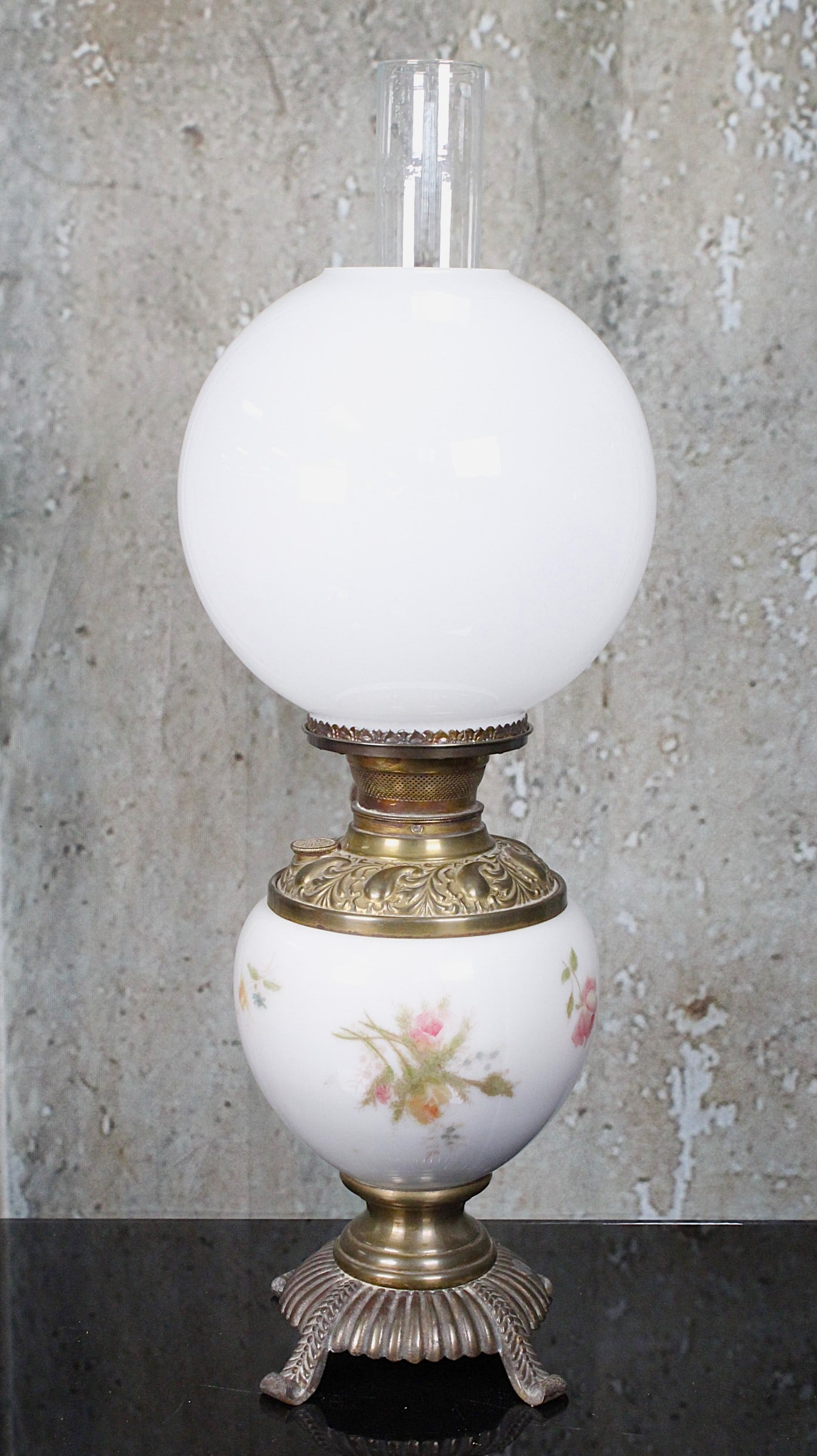A Victorian GWTW Style Parlor Lamp: Decorated opal glass base w/bronzed plinth surmounted with a replaced opal shade, later electrified, VG+ working cond, 25"H incl chimney