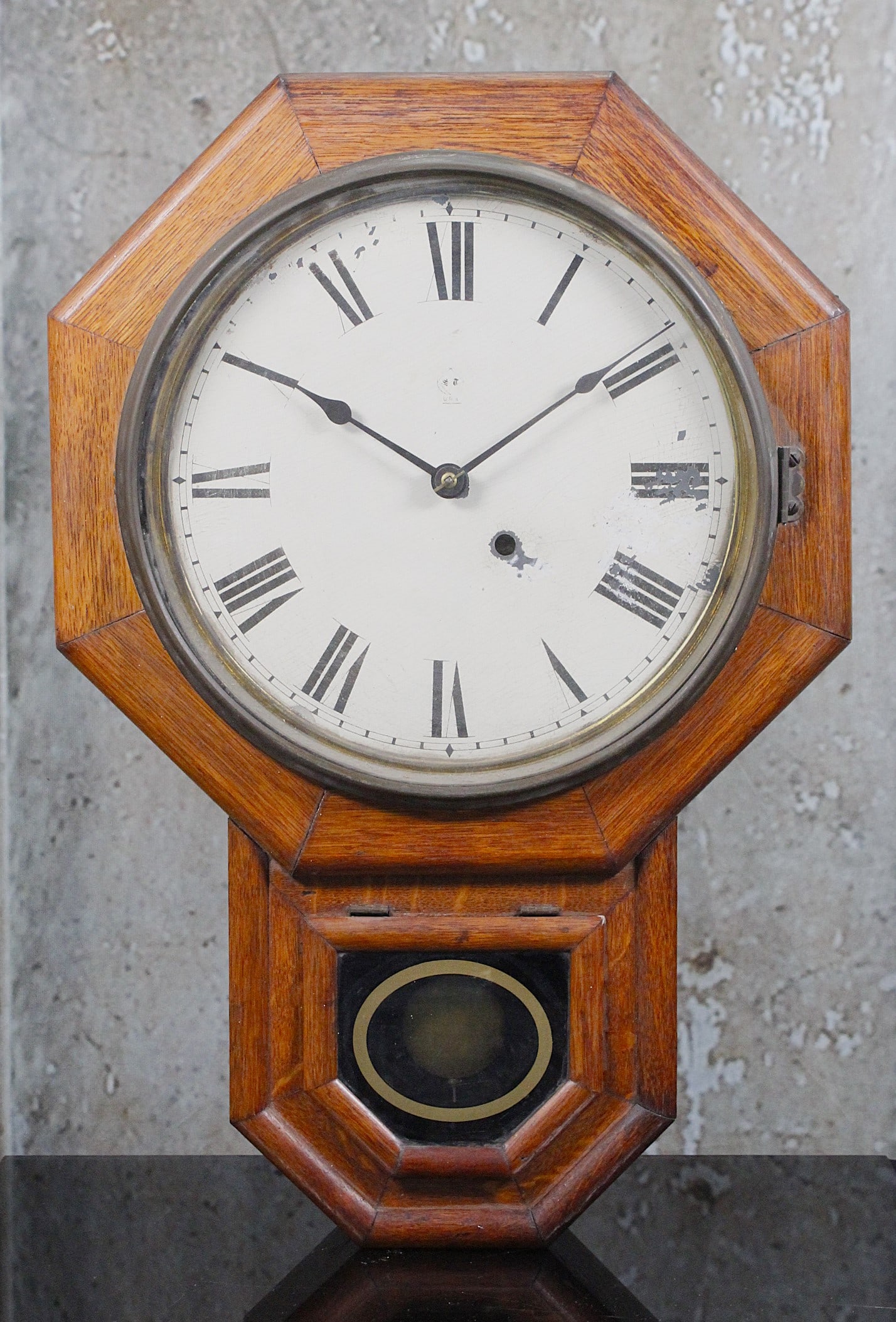 A Seth Thomas School House Regulator: Octagonal oak case with 8 day movement, G+ working original cond'. 25"T.