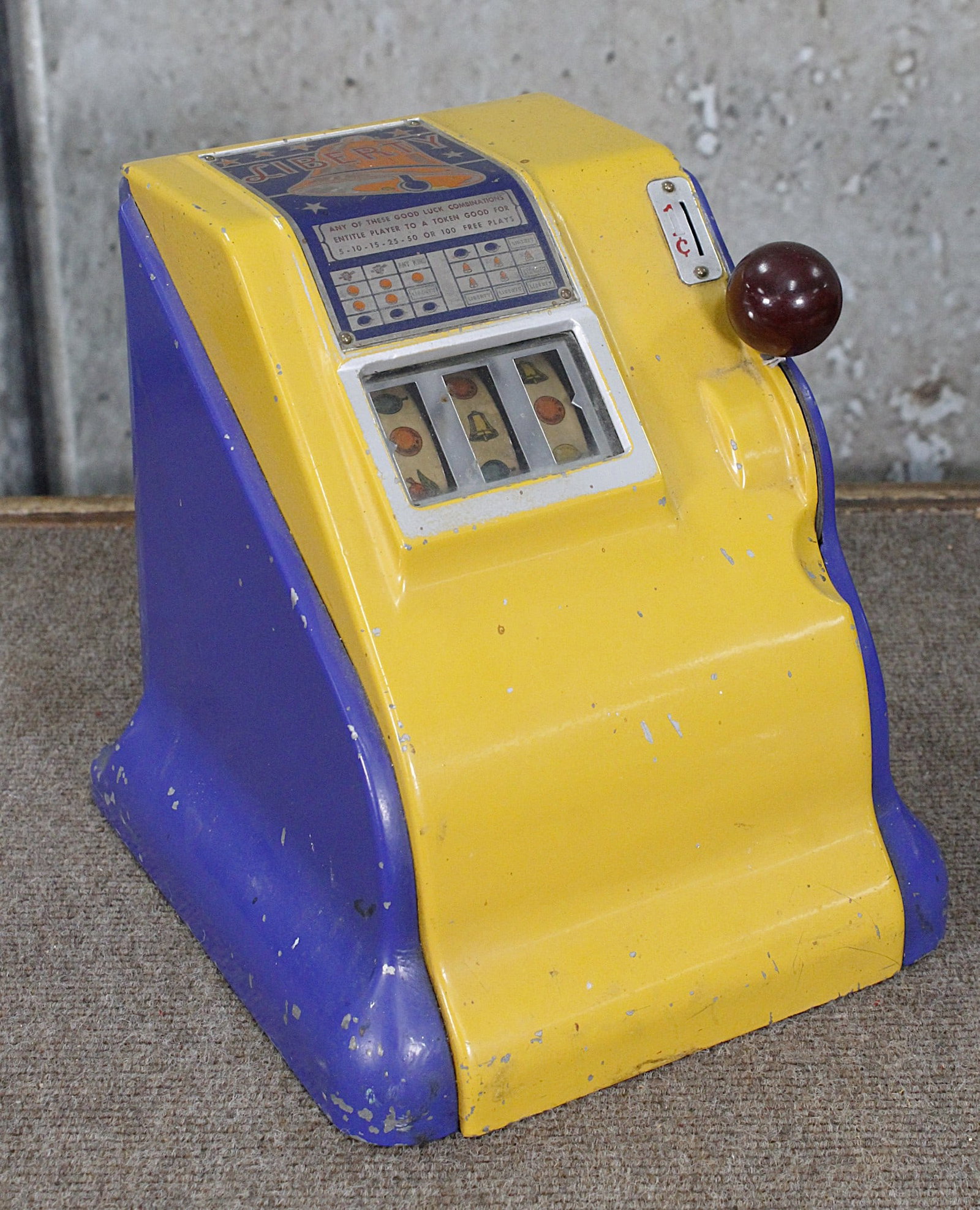 A Liberty 1 Cent Coin-Op Slot Trade Stimulator: 3 wheel with original paint in VG working cond. W/keys 15"H.(coin box absent)