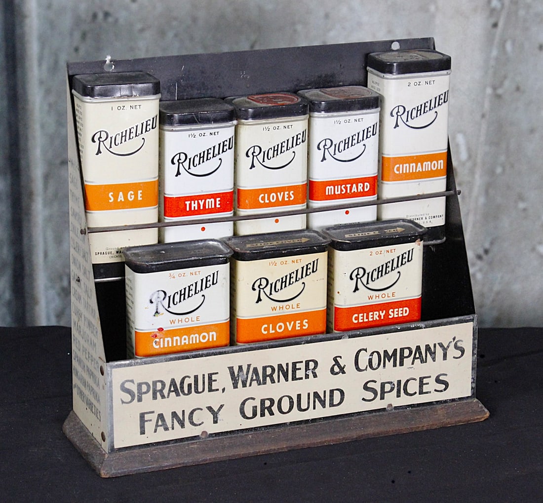 A Richelieu Counter Top Spice Display: Tin litho for Sprague. Warner & Company with 8 containers, G+ to VG cond. 8.5"H.
