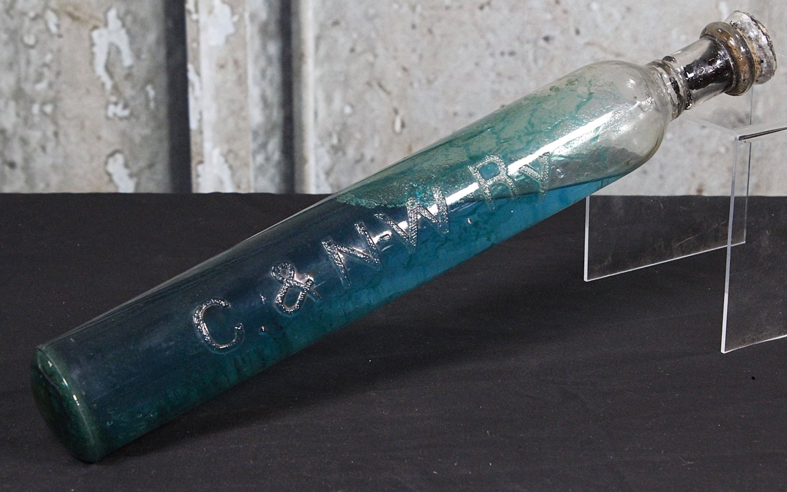 A Chicago & NorthWestern Railway Glass Fire Extinguisher: Early 20th century glass with embossed initials, VG cond. 17.5"L.