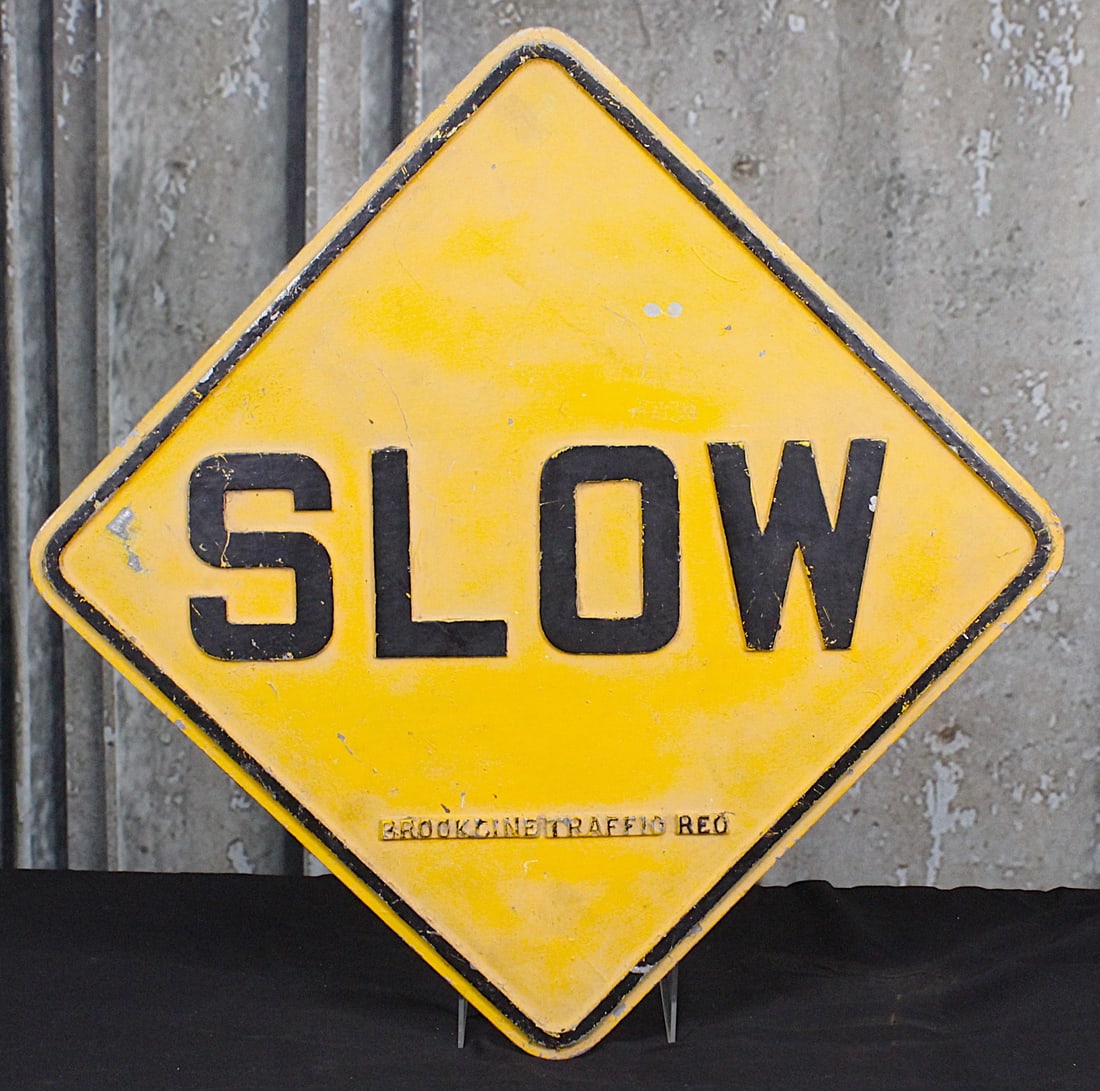 A Vintage Slow Caution Sign: Cast aluminum with raised letter and post brackets on verso, VG cond. 18"Sq.