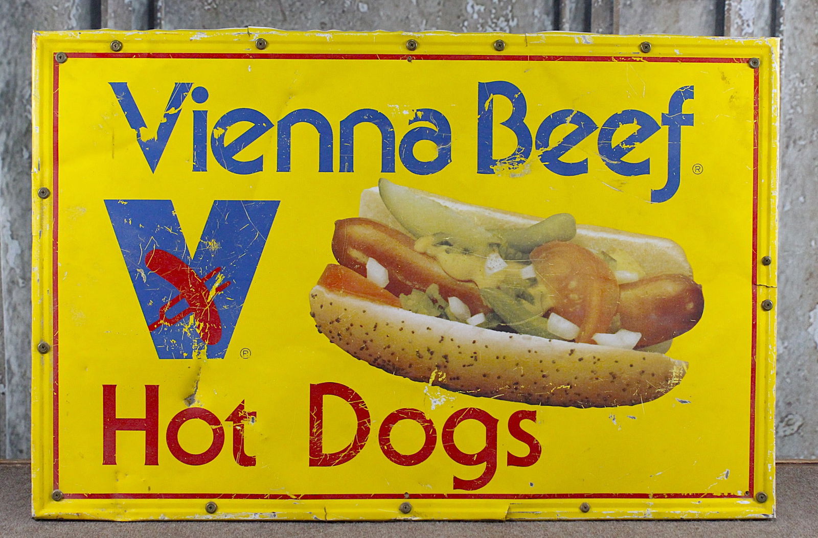 A Vienna Beef Hot Dogs Advertising Sign: Litho on aluminum, later screwed to back frame, G+ cond w/wear, dings & hole, 23"H x 34"W.