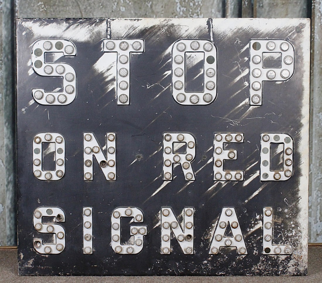 A Vintage Railroad Crossing Sign: Pressed steel self framed with reflective buttons, G+ cond with paint fade/wear & several buttons absent.22.5"H x 25.5"W.