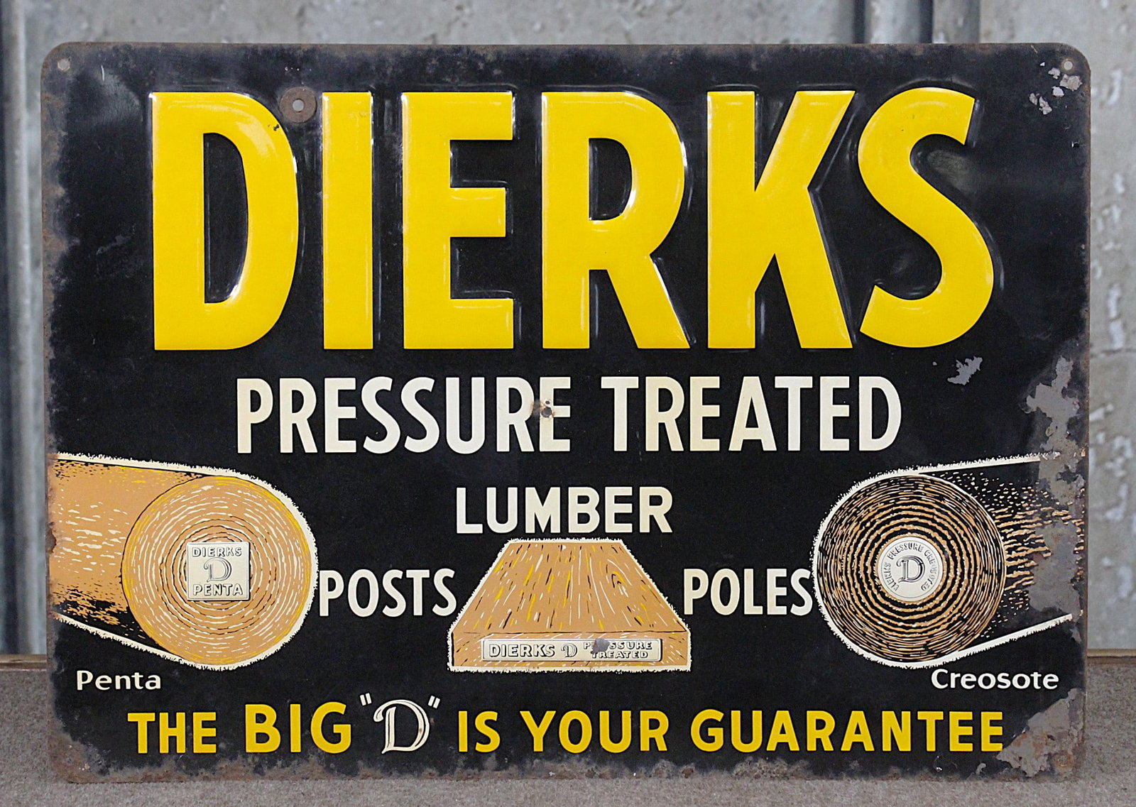 A Dierks Lumber Advertising Sign: Embossed tin litho, G cond w/edge oxidation. 16"H x 22.5"W.