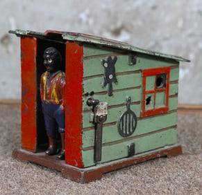 A Black American Cast Iron Mechanical Bank