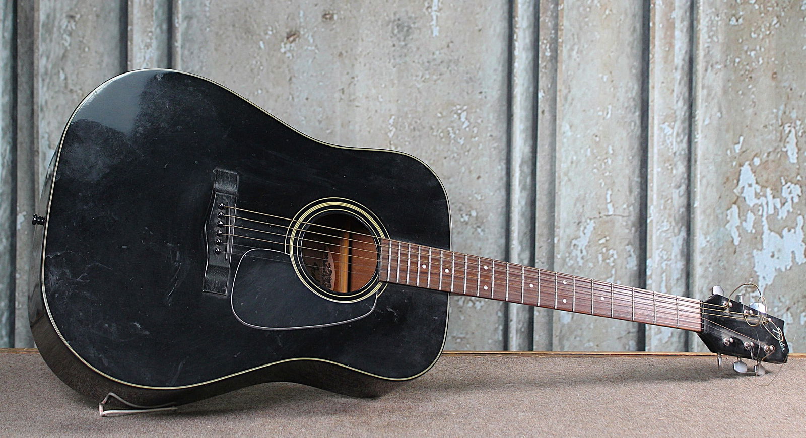 A Fender Acoustic Guitar Model Gemini III: 6 string black lacquer, ser #7525115 VG+ cond w/some light finish wear. 42"L.