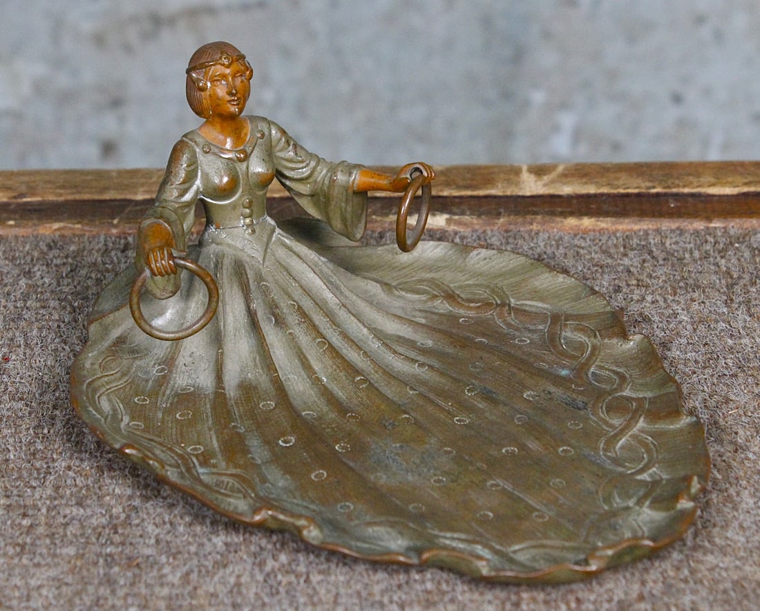 An Art Nouveau Bronze Calling Card Tray: late 19th century of a woman with fanned skirt, likely Austrian, apparently unmarked, VG cond. 6.25"L.