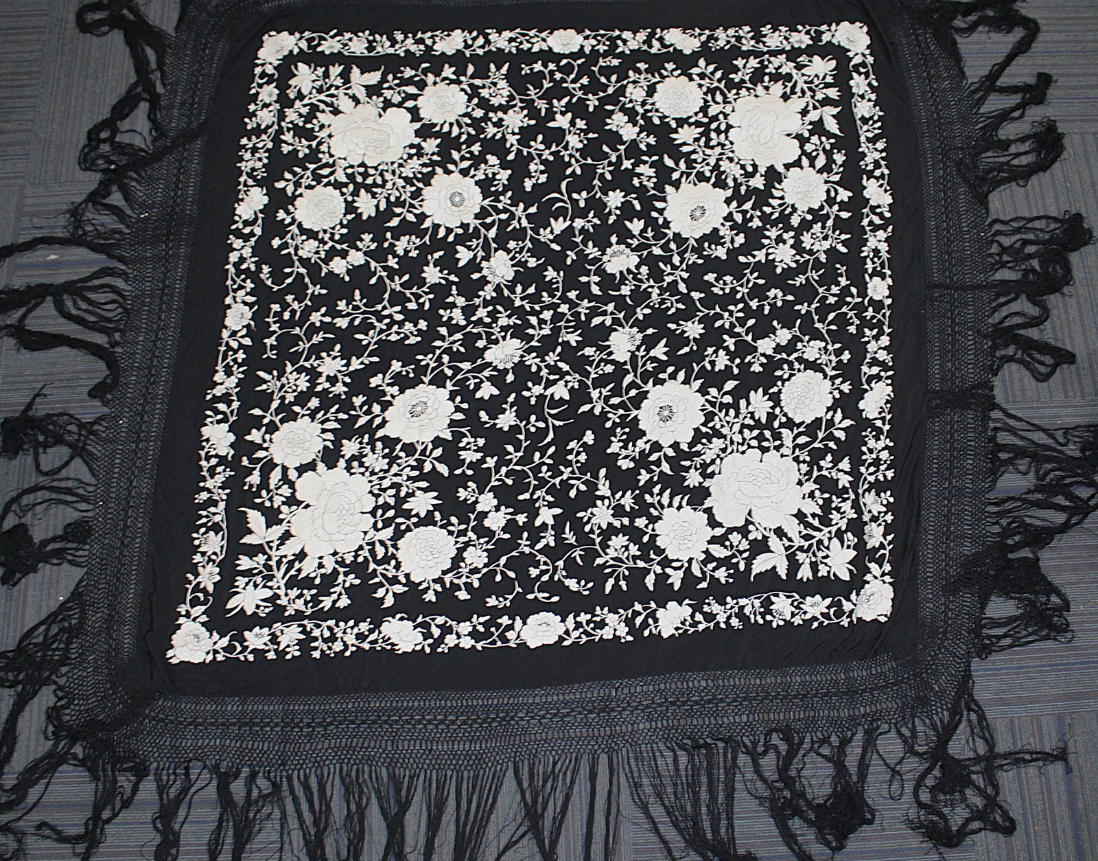 A Fine Chinese Canton Embroidered Piano Shawl: Black Silk w/white embroidered floral blossoms, VG cond. 60"Sq field excluding lace and fringe.