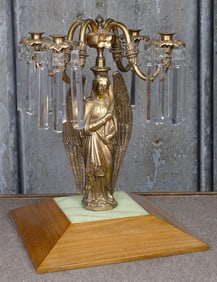 A Gilt Bronze Angel Candelabrum