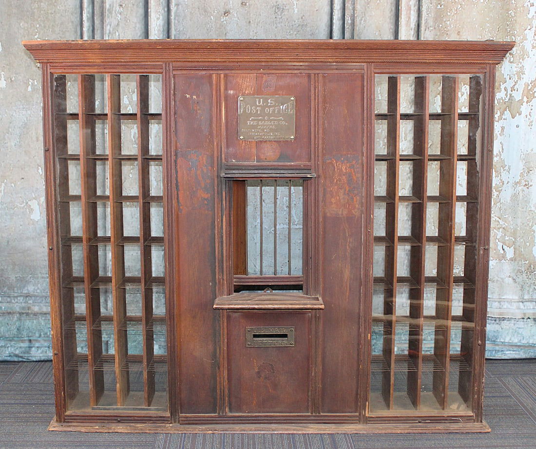 A Oak Country Post Office Mail Sort Window: Early 20th century mfg by Sadler Co. with bronze makers plaque & mail slot, VG as found original cond. 47"H x 57"W x10"D.