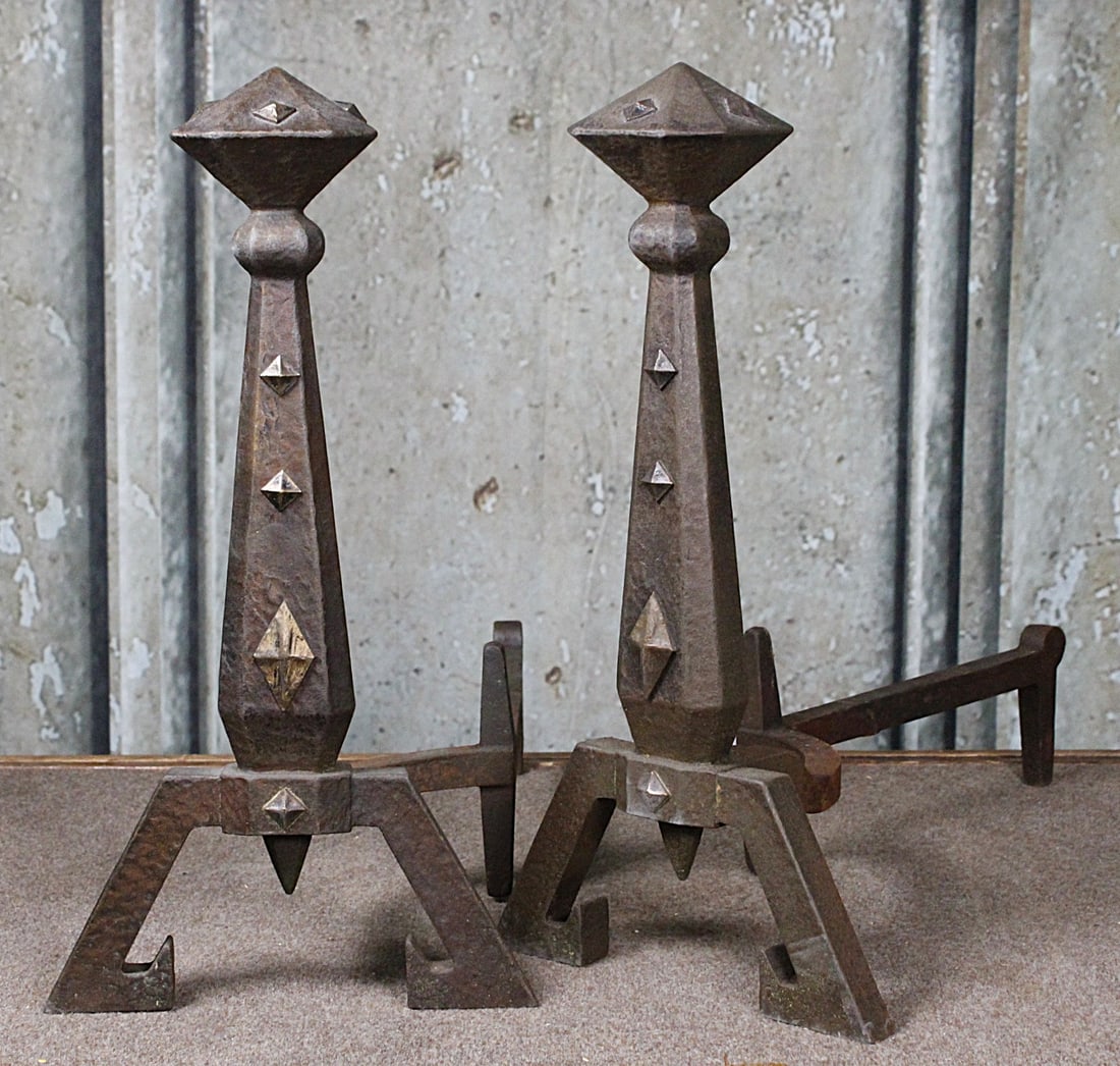 A Pair Of Bradley & Hubbard Arts and Crafts Andirons: Circa 1900 bronze mounted cast iron in Medieval Gothic form, signed with B&H logo and pattern # 3995, 20.5"H VG+ cond.