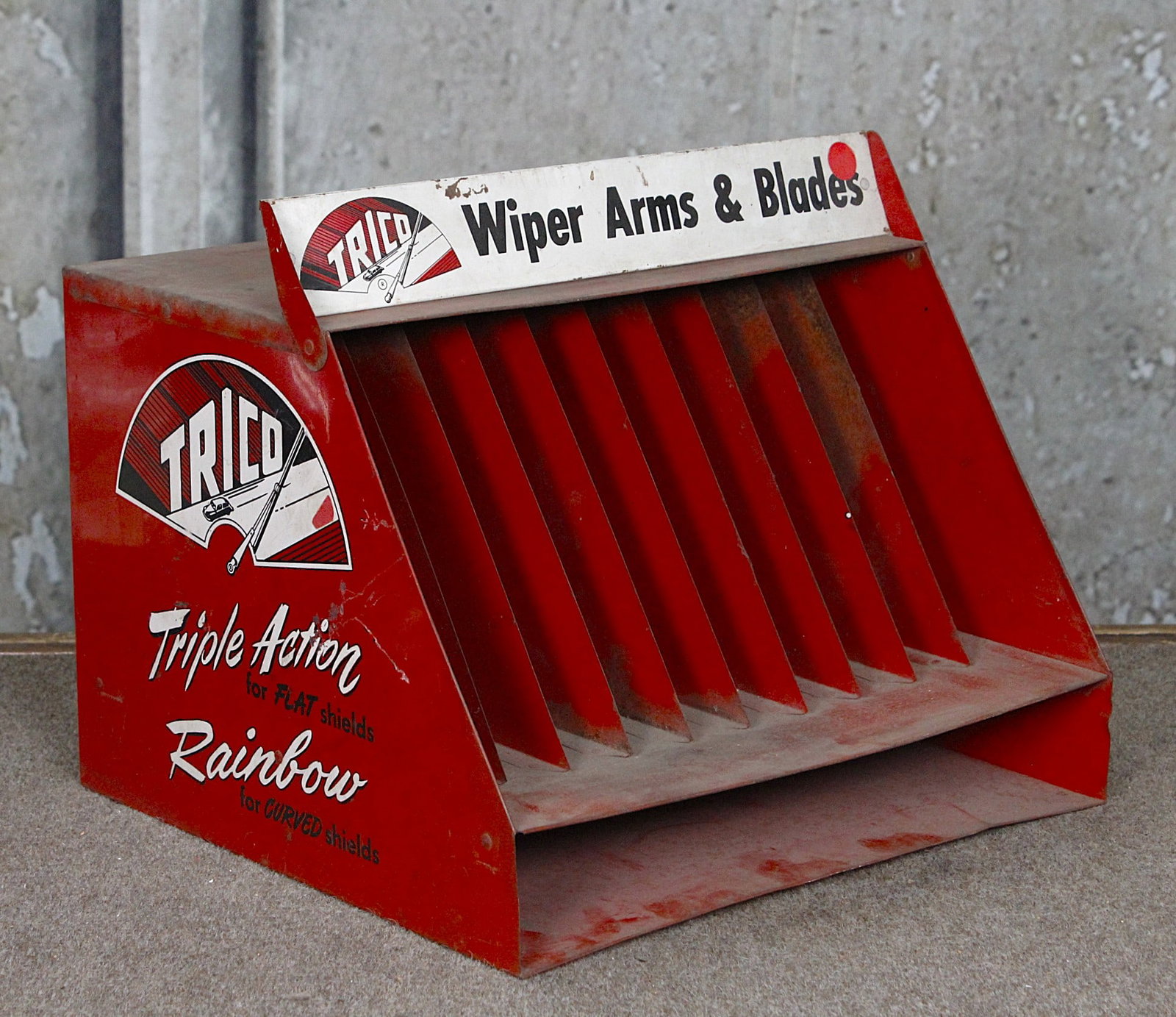 A Trico Wiper Blade Display: Tin litho with folding marquee and three large graphic panels, G+ cond w/some oxidation to top, 12"H x 14"W x 13"D.