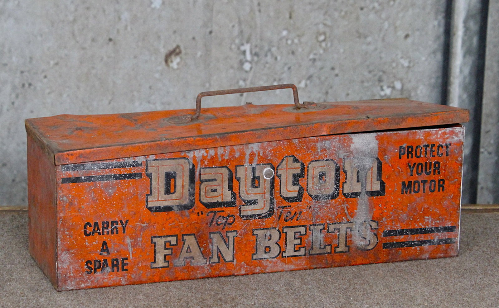 A Dayton Automotive Fan Belts Pump Island Tote: Litho on pressed steel, F+ cond with mis-shaped cover, 17"L.