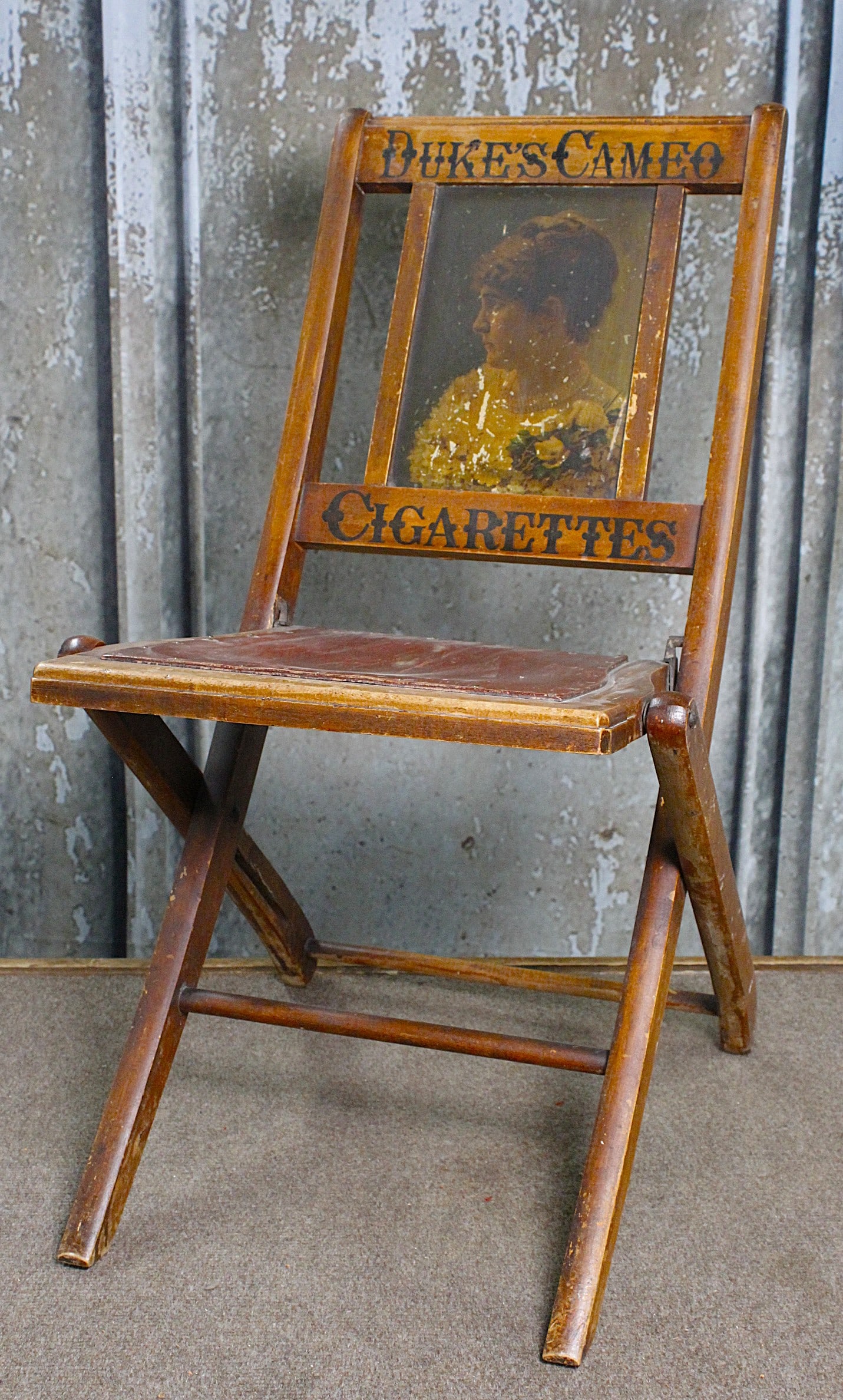 A Duke's Cameo Cigarettes Advertising Chair: Early 20th century folding wood with embossed marquees and portrait litho, G+ cond w/normal wear. 30"H