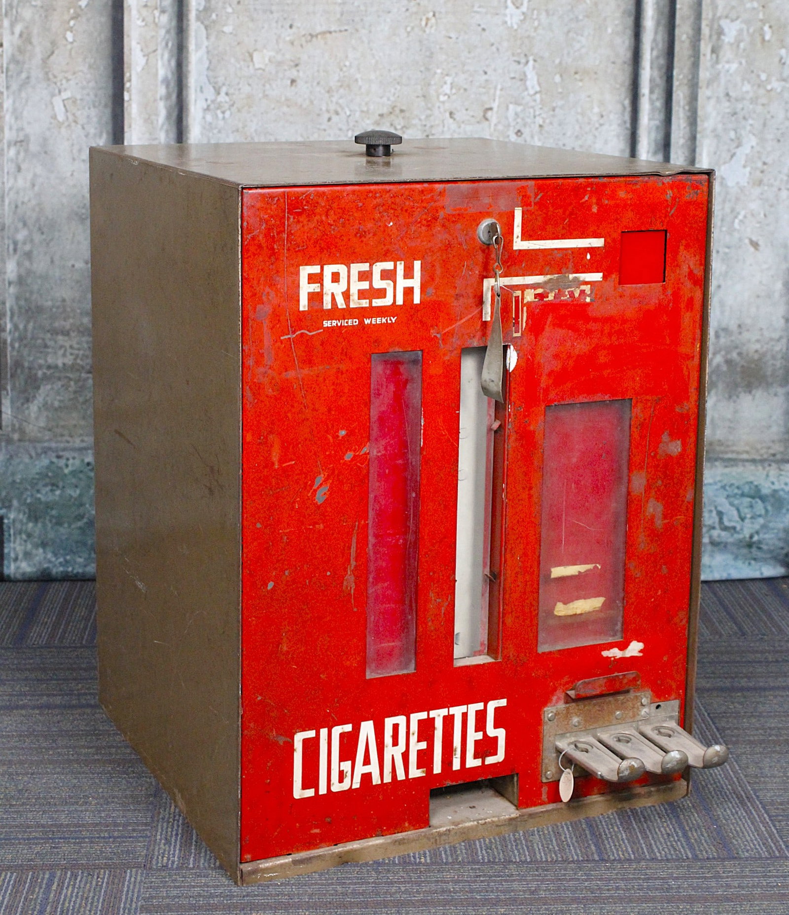 A Coin Operated Counter Top Cigarette Vendor: Pressed Steel with 9 column carousel, F+ to Good untested cond. 25"H x 19"Sq.