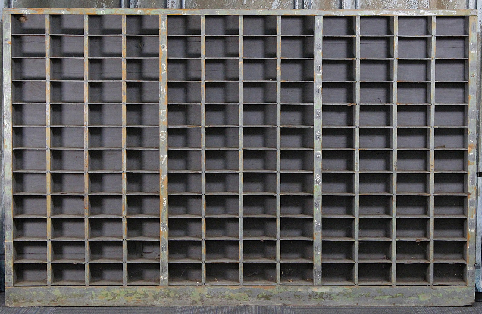A Large Primitive Pine Parts Bin: Early 20th century with remnants or orig paint and reference marks, G+ cond, 61"H x 96"L x 6.5"D.
