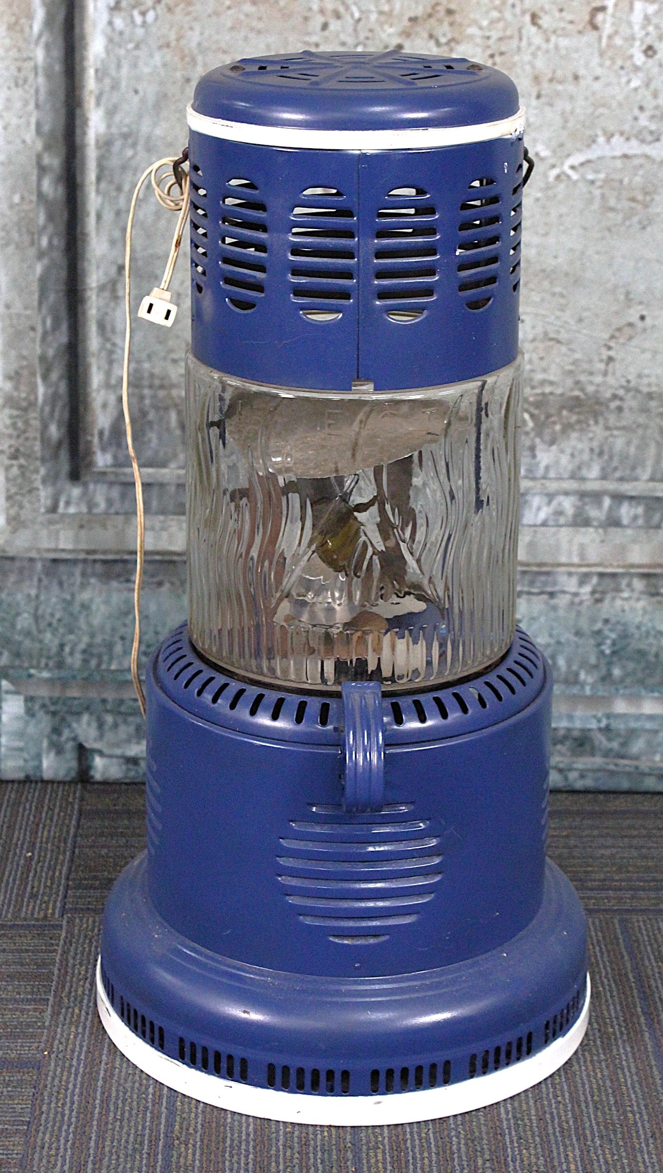 A Perfection Pyrex Oil Heater: Pressed tin and embossed glass, later repainted and with electric light, VG+ cond 27"H.