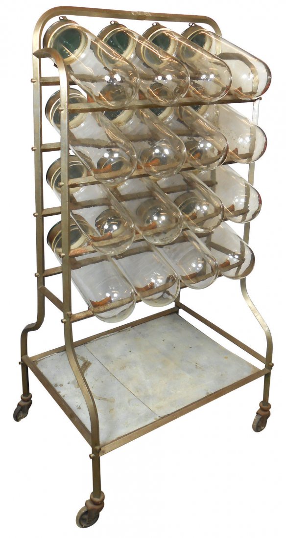 Candy jar display, 16 glass jars w/tip-down lids, an un: Candy jar display, 16 glass jars w/tip-down lids, an unusual display in VG/Exc cond, 57"H x 29"W.