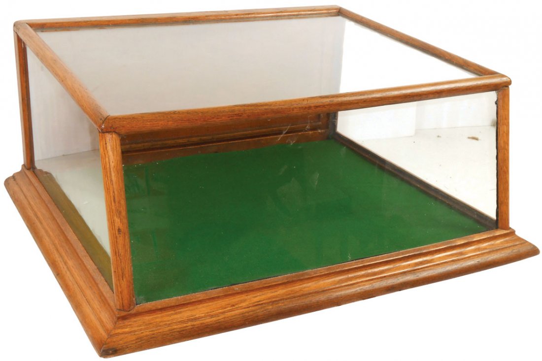 Counter display case, oak slant front, hinged back door: Counter display case, oak slant front, hinged back door w/lock & key, Exc cond, 12"H x 25.5"W x 20"D.