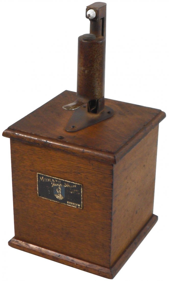 Cigar lighter, Midland Jump Spark, mfgd by Davenport Mf: Cigar lighter, Midland Jump Spark, mfgd by Davenport Mfg Co.-Davenport, IA, c.1920, oak case w/orig metal tag, VG orig cond, 15"H x 7.25"Sq.