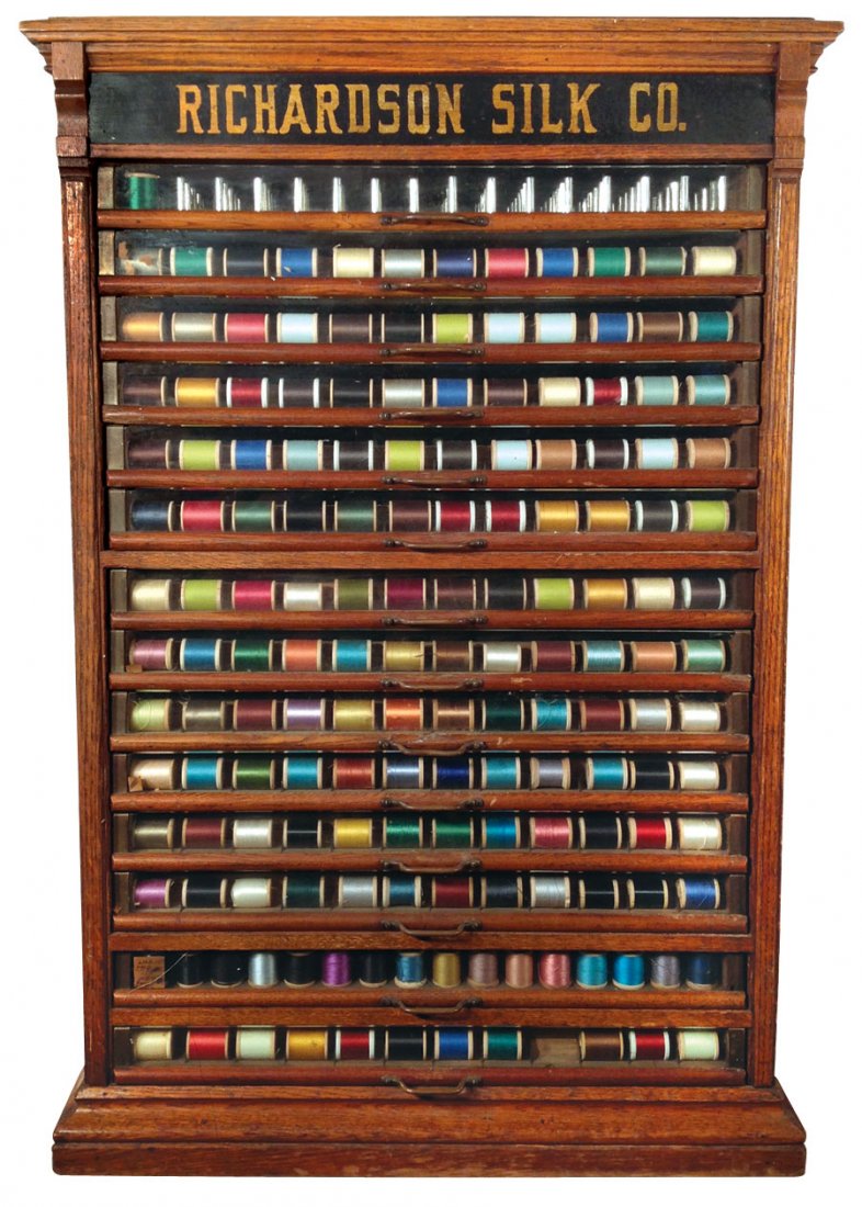 Spool cabinet, Richardson Silk Co., oak w/14 glass fron: Spool cabinet, Richardson Silk Co., oak w/14 glass front drwrs, c.1890, Exc cond w/orig surface, 35"H x 22.5"W x 17"D.