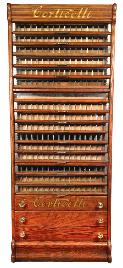 Spool cabinet, Corticelli, oak 19 drwr, 16 glass front: Spool cabinet, Corticelli, oak 19 drwr, 16 glass front & 3 wood, side panel w/Corticelli advertising, unusual tall cabinet in Exc cond w/orig surface, 53"H x 21"W x 17.5"D.