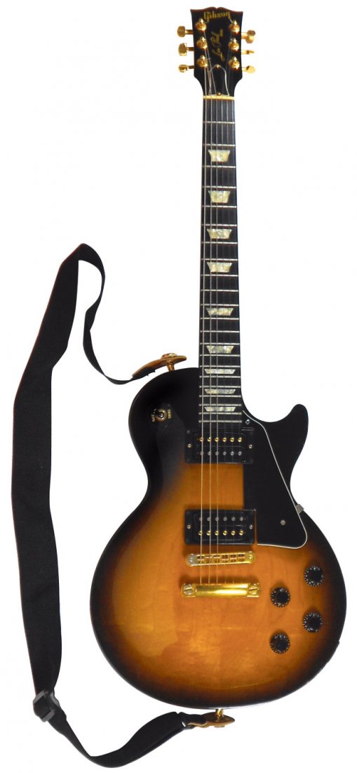 Guitar, Gibson Les Paul (Studio), No. 91765302, c.1995: Guitar, Gibson Les Paul Studio Lite model in Vintage Sunburst finish and gold hardware, made in 1995 in Nashville, TN. No. 91765302, Exc cond in orig case w/front change combination lock, 42"H x 15"W.