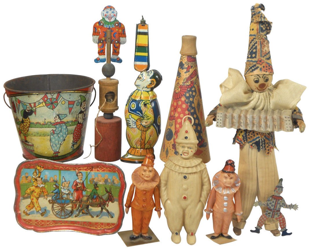 Circus clowns, tin pail, toys, etc (10), includes litho: Circus clowns, tin pail, toys, etc (10), includes litho on tin sand pail & tray, windup toy (works great), (3) celluloid clowns (one is rattle), clown w/accordion marked Darmestadt, Germany, pressed c