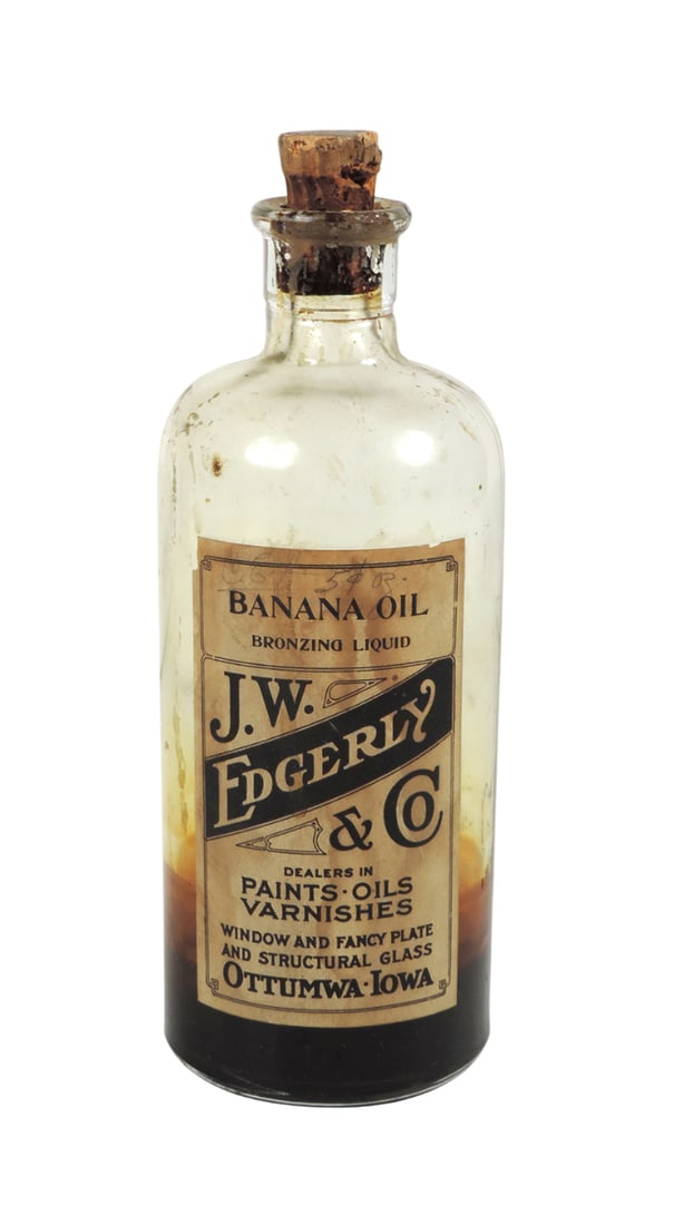 Drug Store Banana Oil Bottle, J.W. Edgerly & Co., Banana Oil, Bronzing Liquid, Dealers in Paints-...: Drug Store Banana Oil Bottle, J.W. Edgerly & Co., Banana Oil, Bronzing Liquid, Dealers in Paints-Oils-Varnishes, Window and Fancy Plate and Structural Glass, Ottumwa-IA, glass bottle w/paper label & c